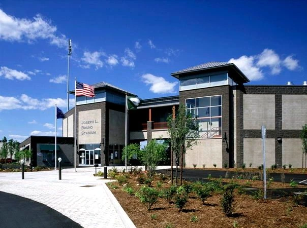 Contemporary building with metal-clad facade and glass entry