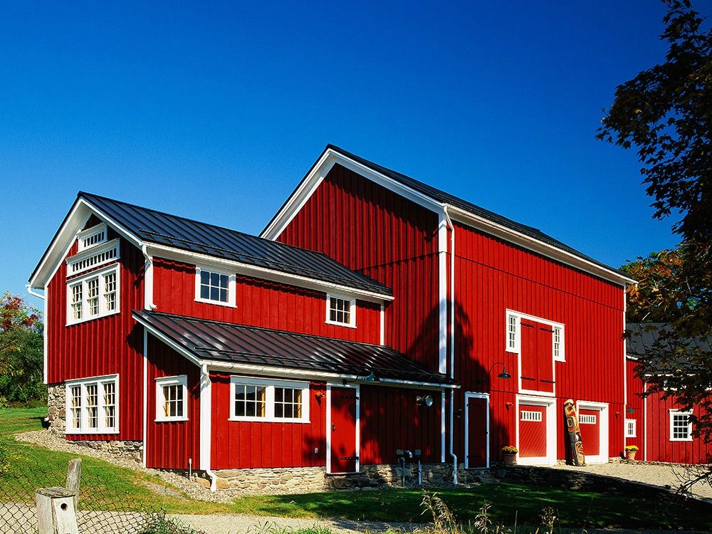 Red barn-style building with multiple standing seam roof planes