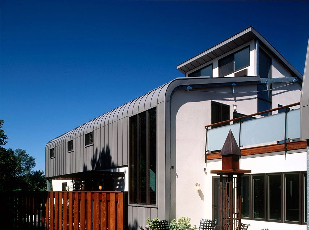 Contemporary building with steep metal roof planes